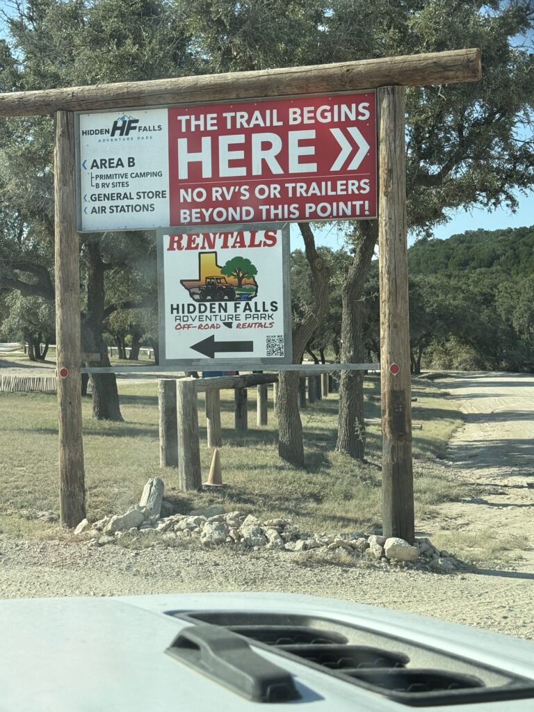 Hidden Falls Adventure Park trailhead sign showing Area B camping and trail entrance